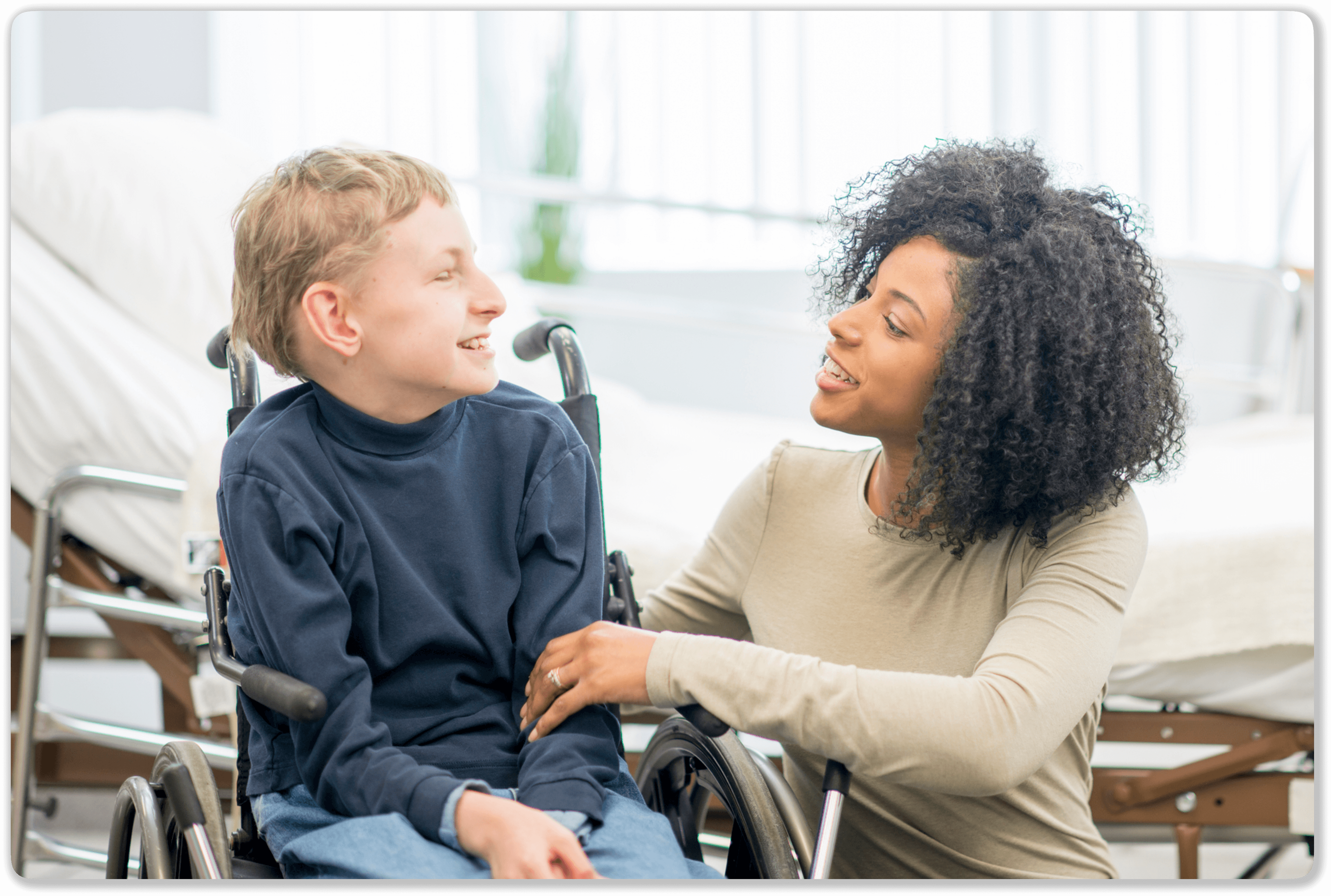 Adult caregiver assisting a special needs child